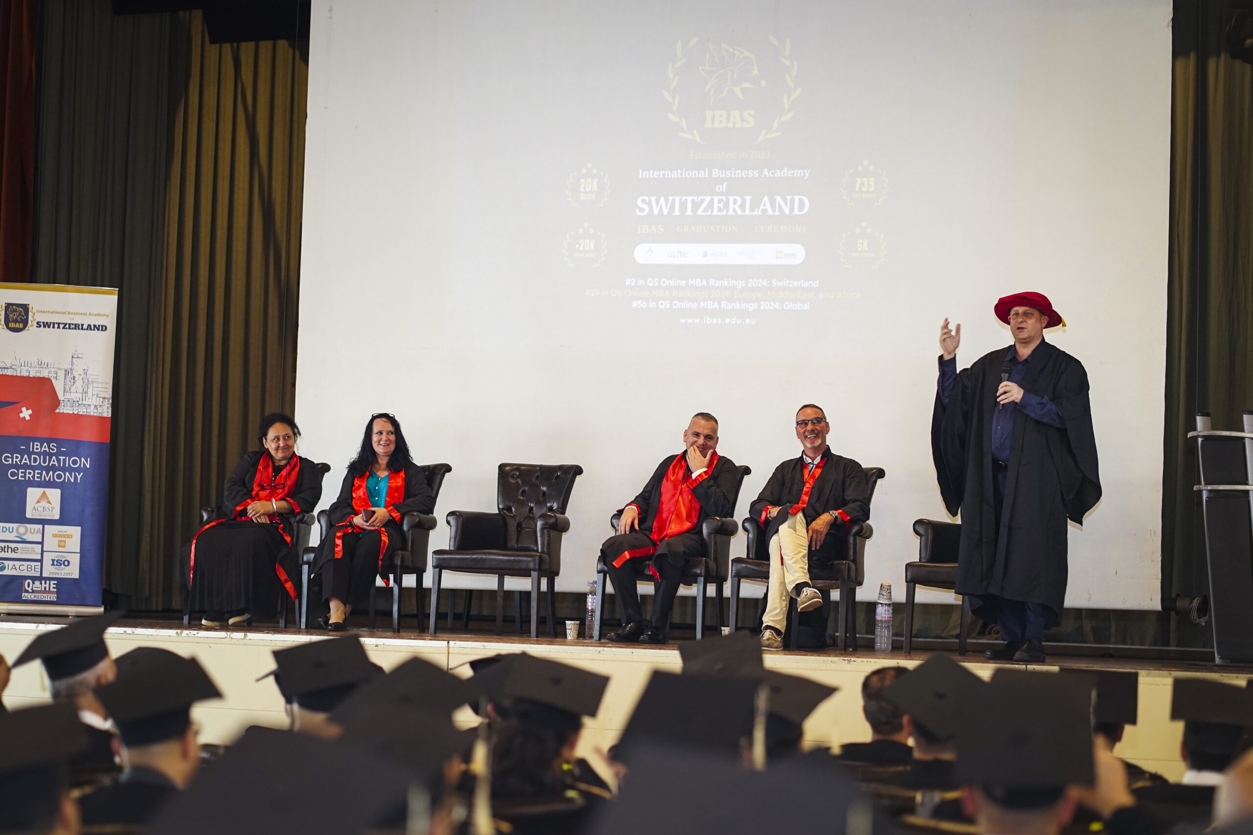 Person delivering a speech at a graduation ceremony